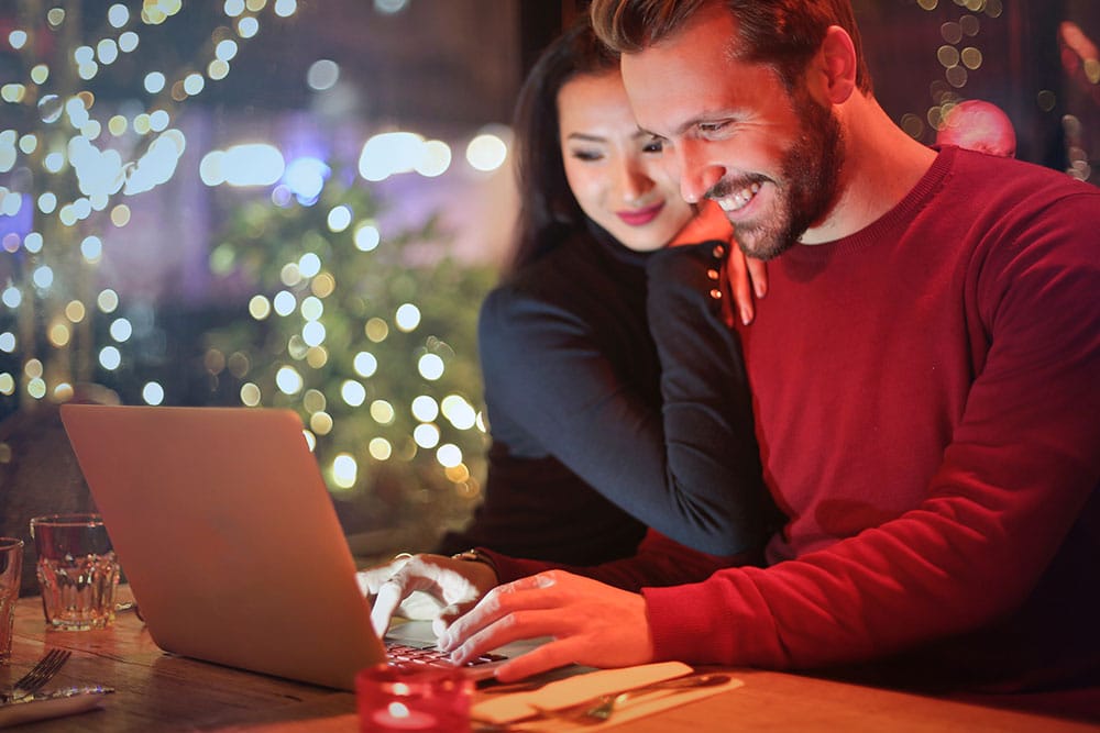 Smiling couple on a computer